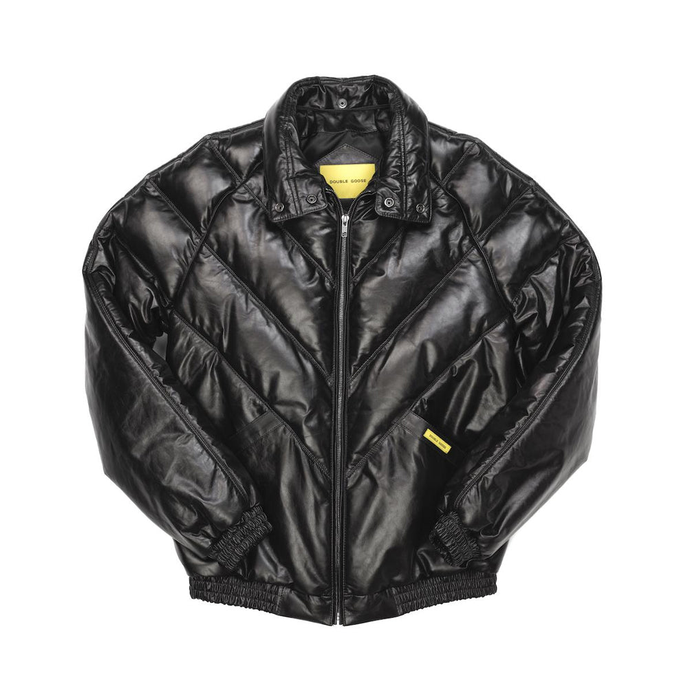 A black quilted bomber jacket with a shiny finish, featuring a full-zip front, ribbed collar, cuffs, and hem, with small yellow brand tags on the chest and inside the collar.
