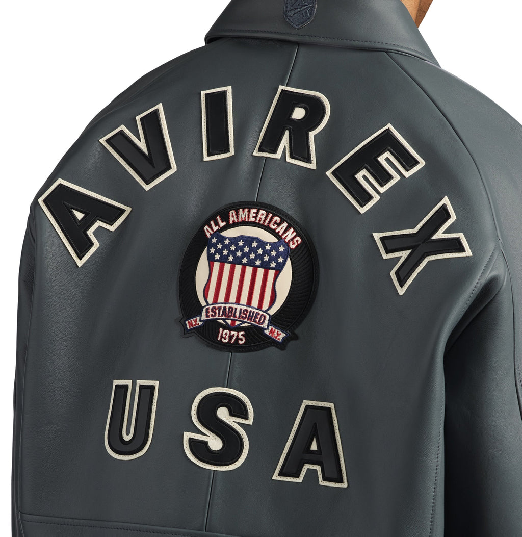 Close-up of AVIREX lettering and embroidered shield on jacket back