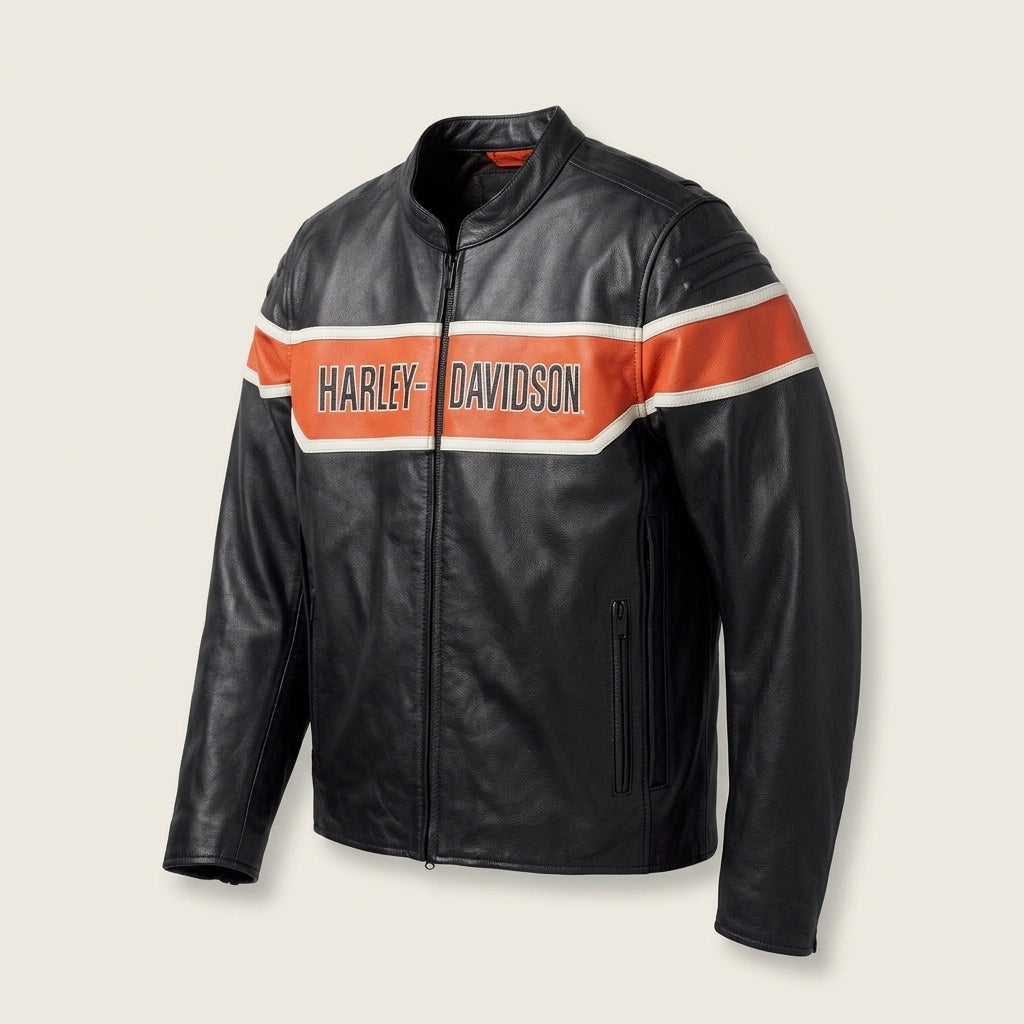 A black leather motorcycle jacket with a prominent orange and white chest stripe featuring the Harley-Davidson logo, shown against a light beige background.
