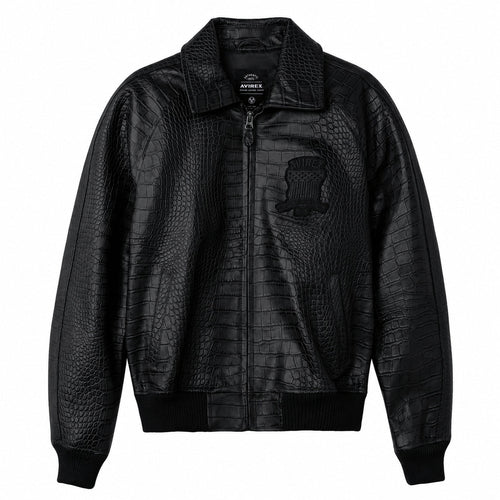 A black crocodile-embossed leather jacket with a stand collar, front zipper, ribbed knit cuffs and hem, and a tonal chest patch, shown on a plain white background.