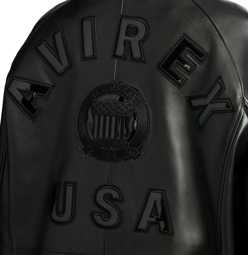 Black leather jacket with 'Avirex USA' branding on a white background