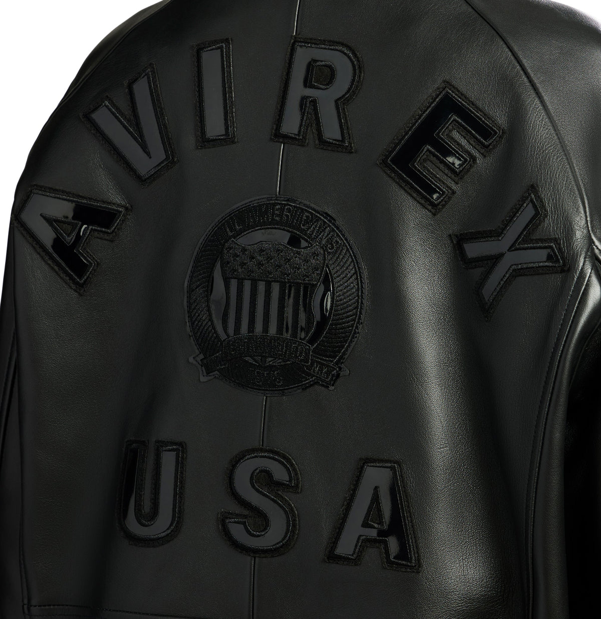 Black leather jacket with 'Avirex USA' branding on a white background