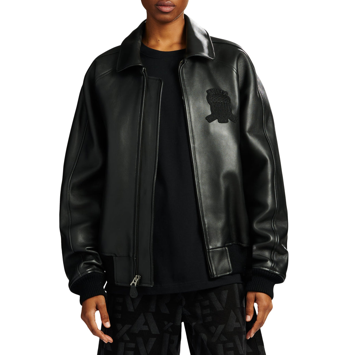 model posing front of avirex jacket