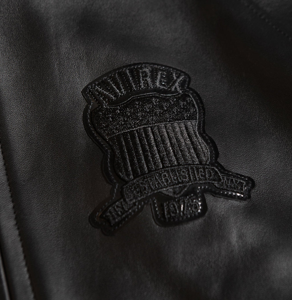 Dark metallic front zipper on black lambskin jacket
