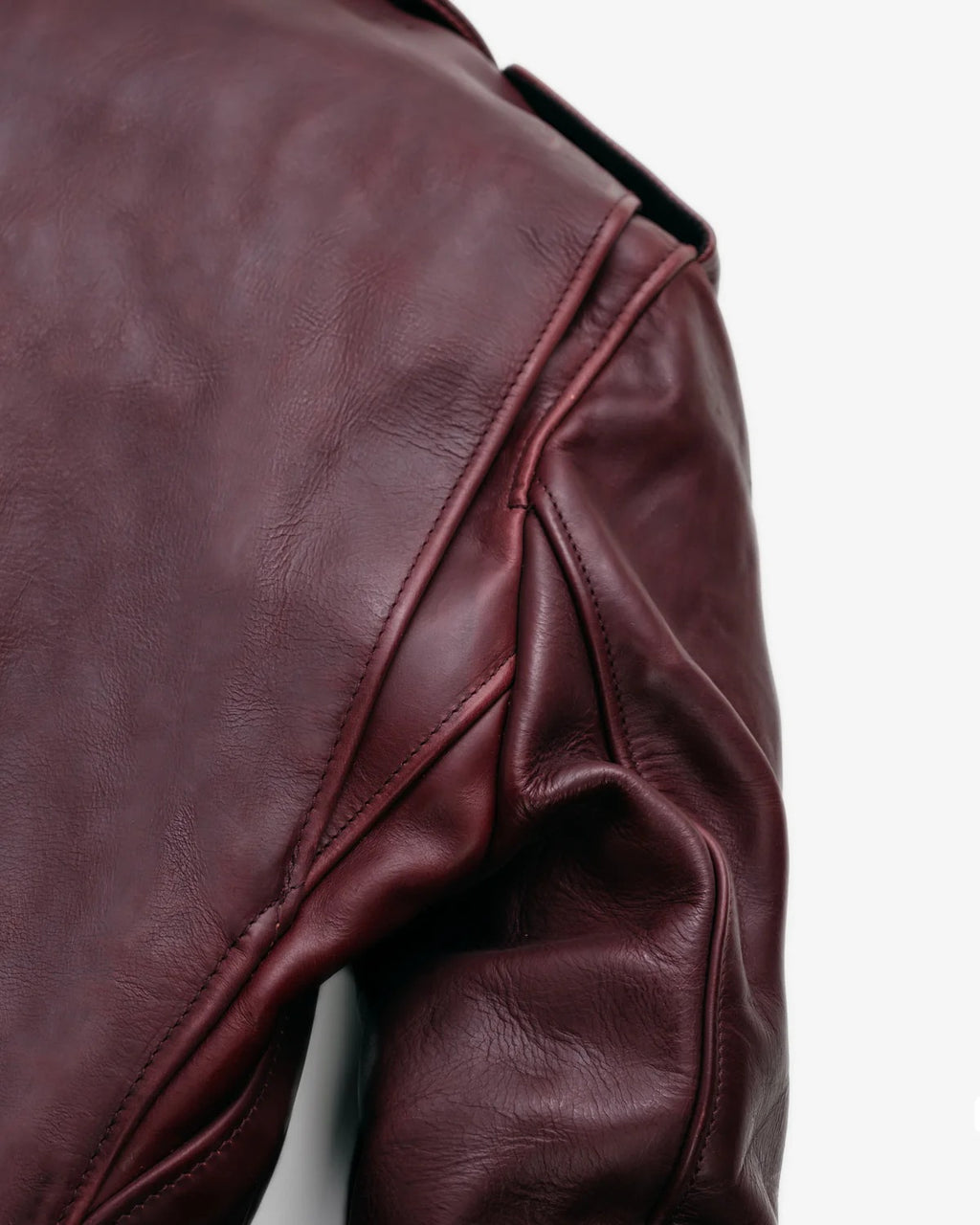 Close-up of a Burgandy leather jacket on a white background