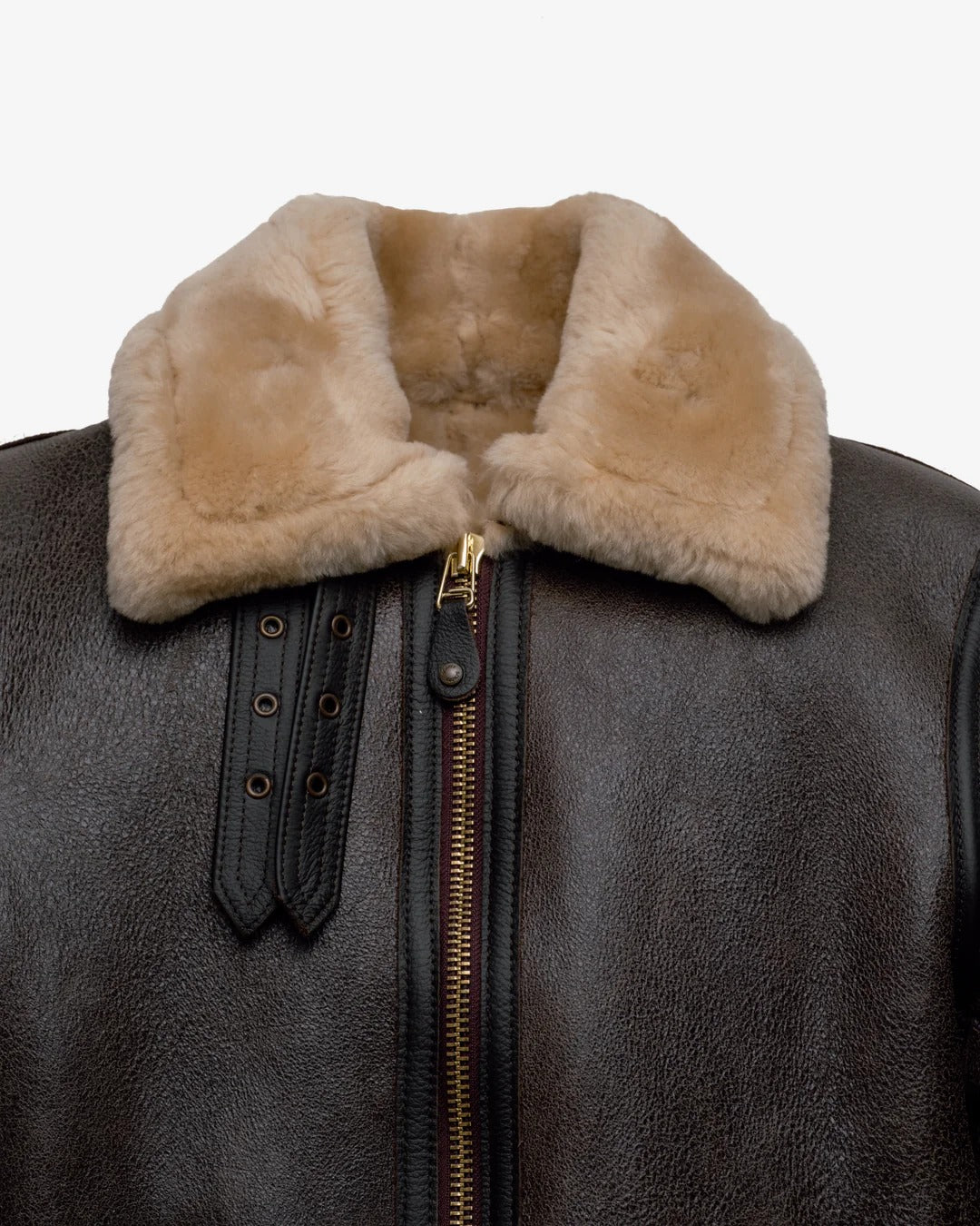 Close-up of a leather jacket with a fur collar on a white background