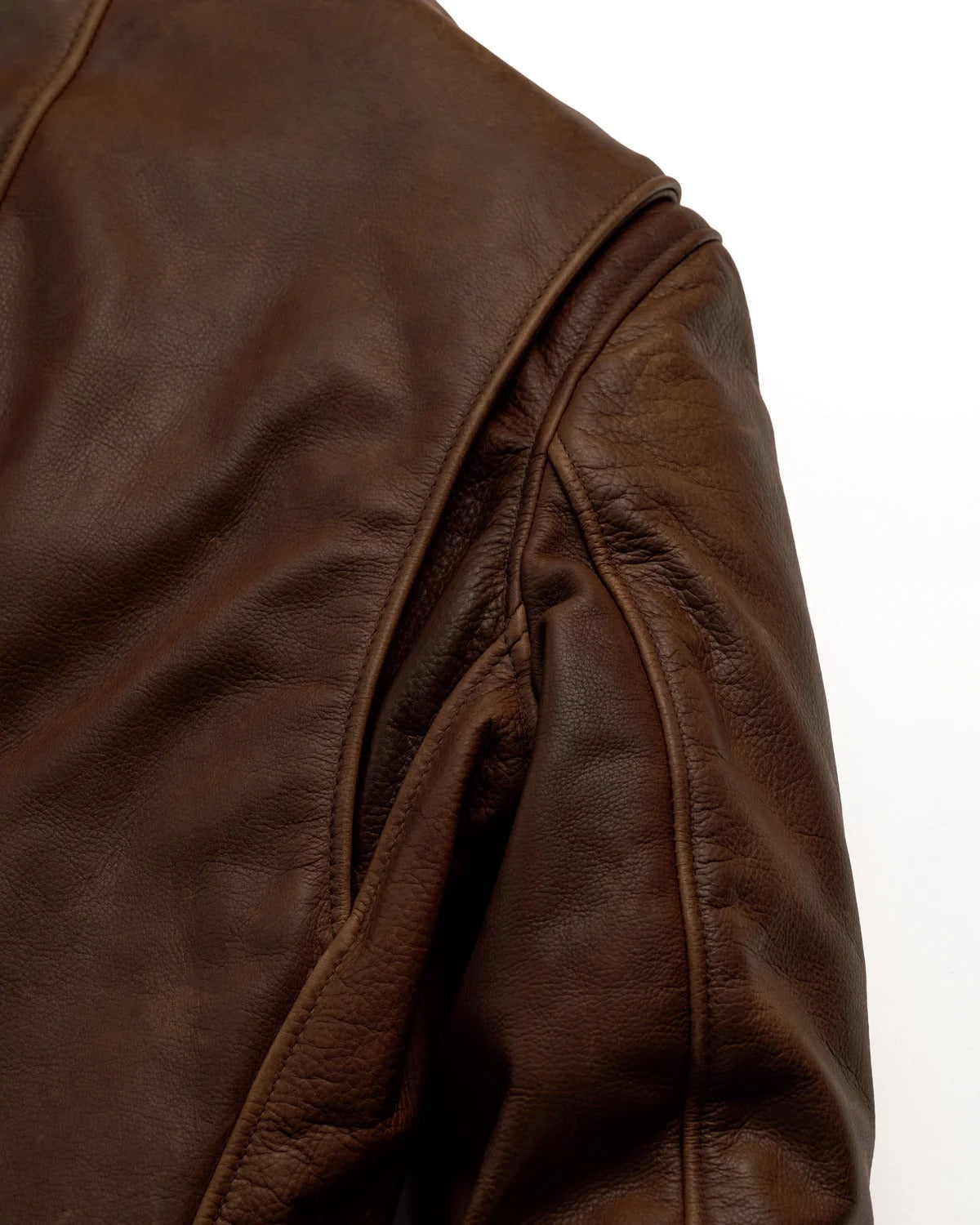 Close-up of a brown leather jacket on a white background