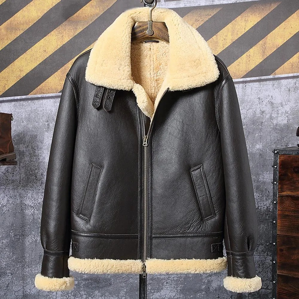 Black leather jacket with beige fur lining on a hanger against a rustic background