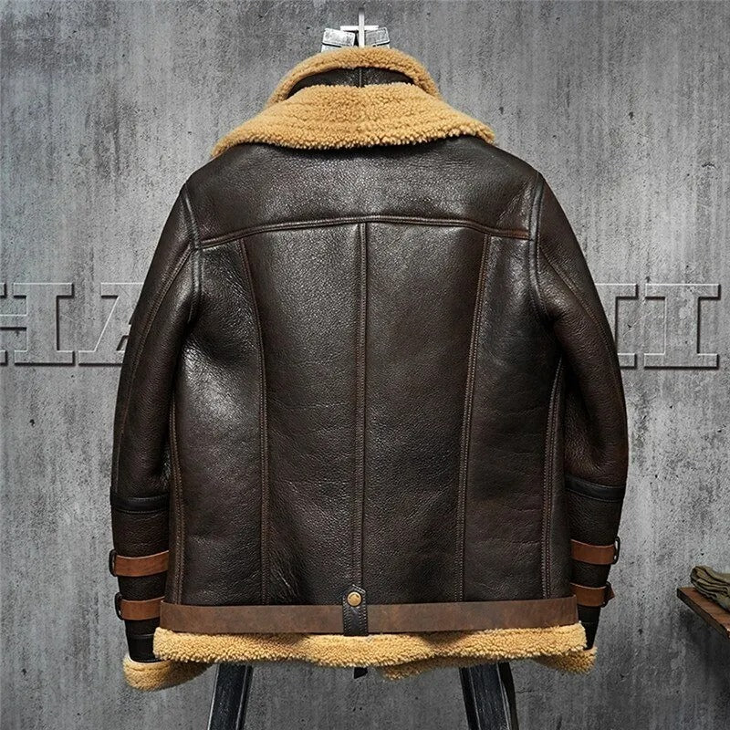 Brown leather jacket with beige fur lining on a gray background