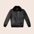 Black leather jacket with fur collar on a beige background