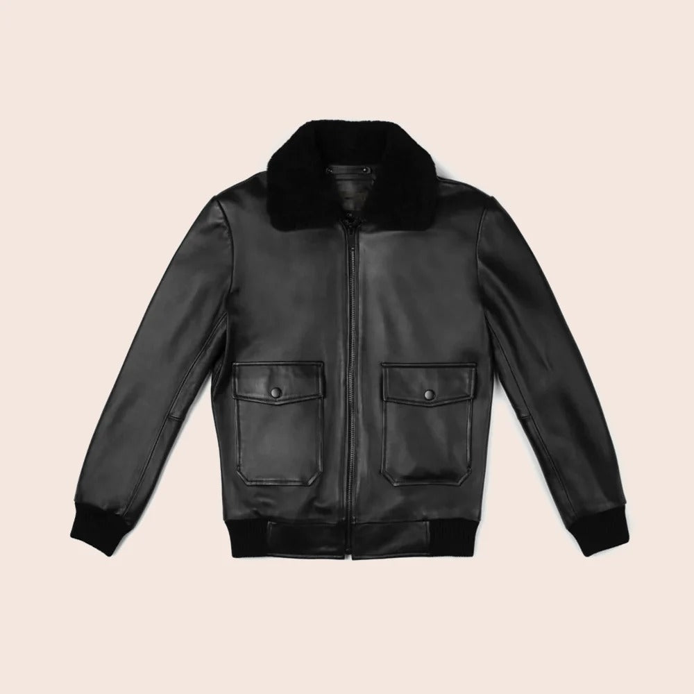 Black leather jacket with fur collar on a beige background