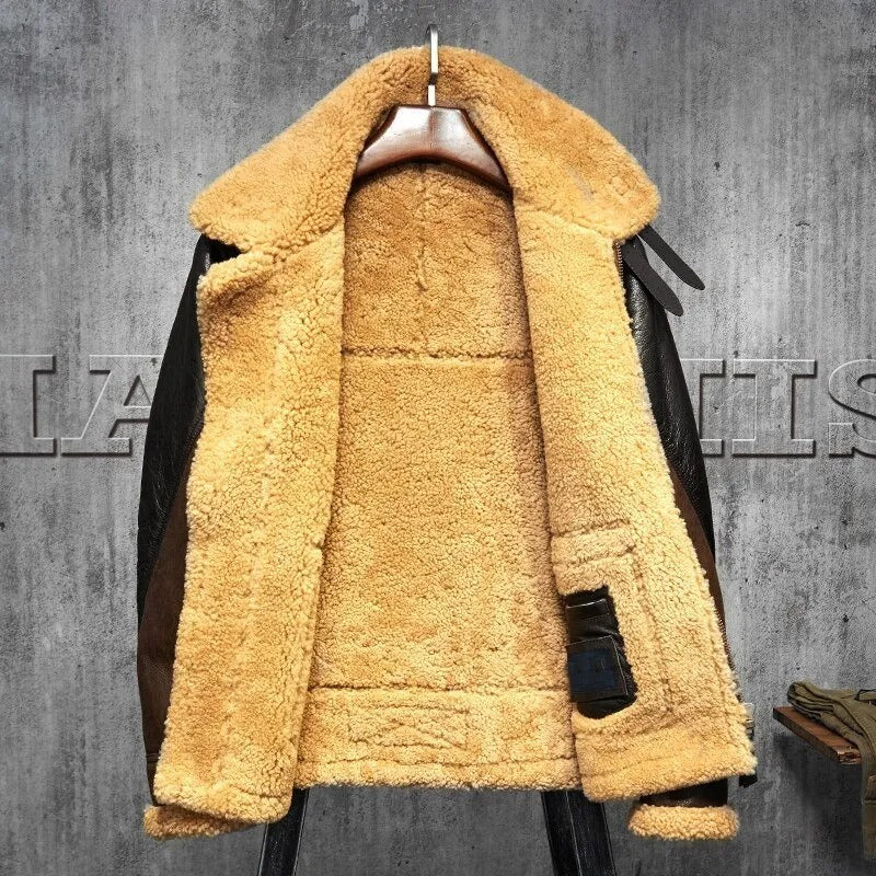 Yellow shearling jacket on a hanger against a gray concrete wall.