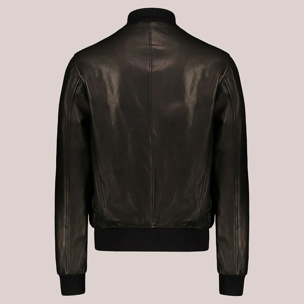 A dark brown leather jacket shown from the back, featuring a high collar, a central seam, ribbed knit cuffs and hem, and a front zipper closure, set against a solid light gray background.