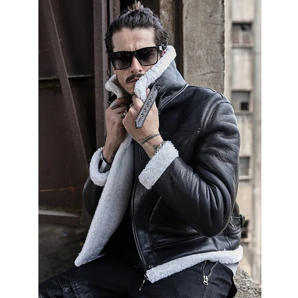 Man wearing a black leather jacket with white fur lining, sunglasses, and holding a gun in an urban setting.