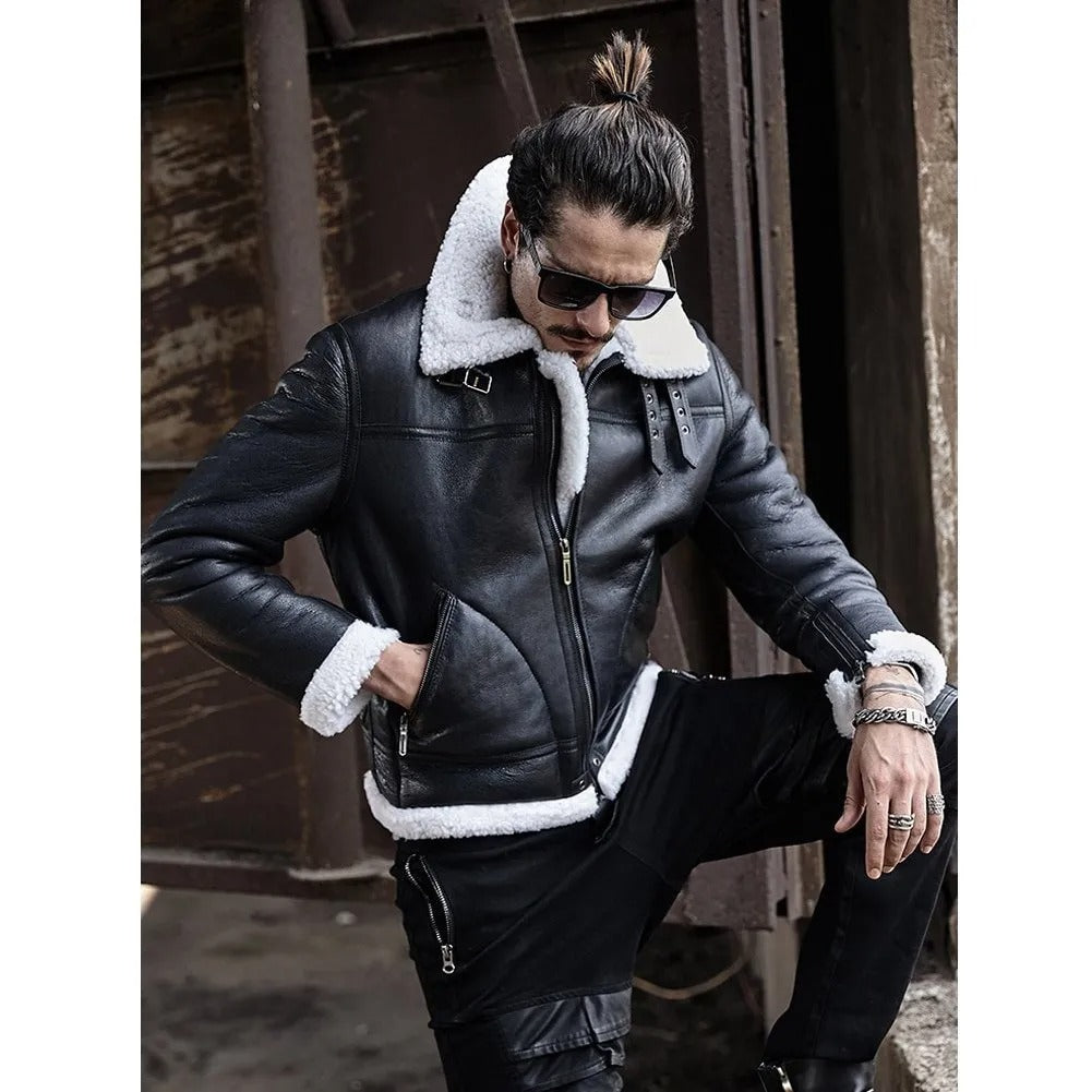 Man wearing a black leather jacket with white fur lining, sunglasses, and black pants in an urban setting.