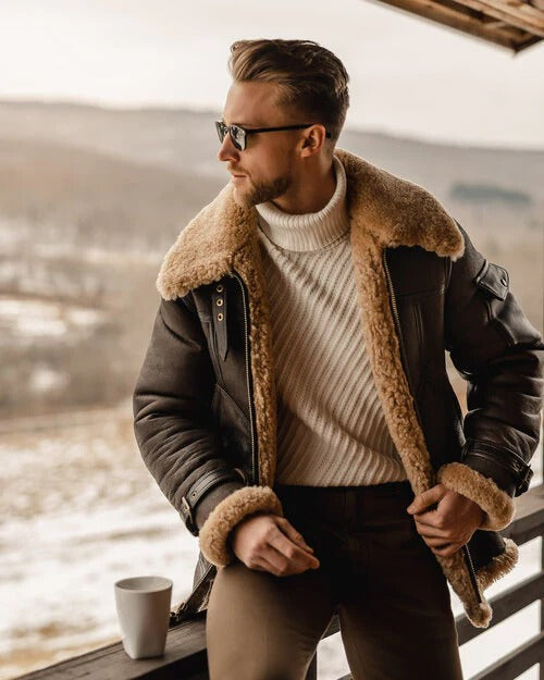 Large natural shearling collar detail on men's brown aviator leather semi-long coat