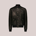Black leather jacket on a beige background