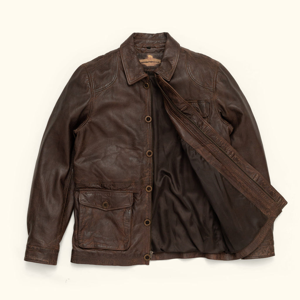 Brown leather jacket on a white background