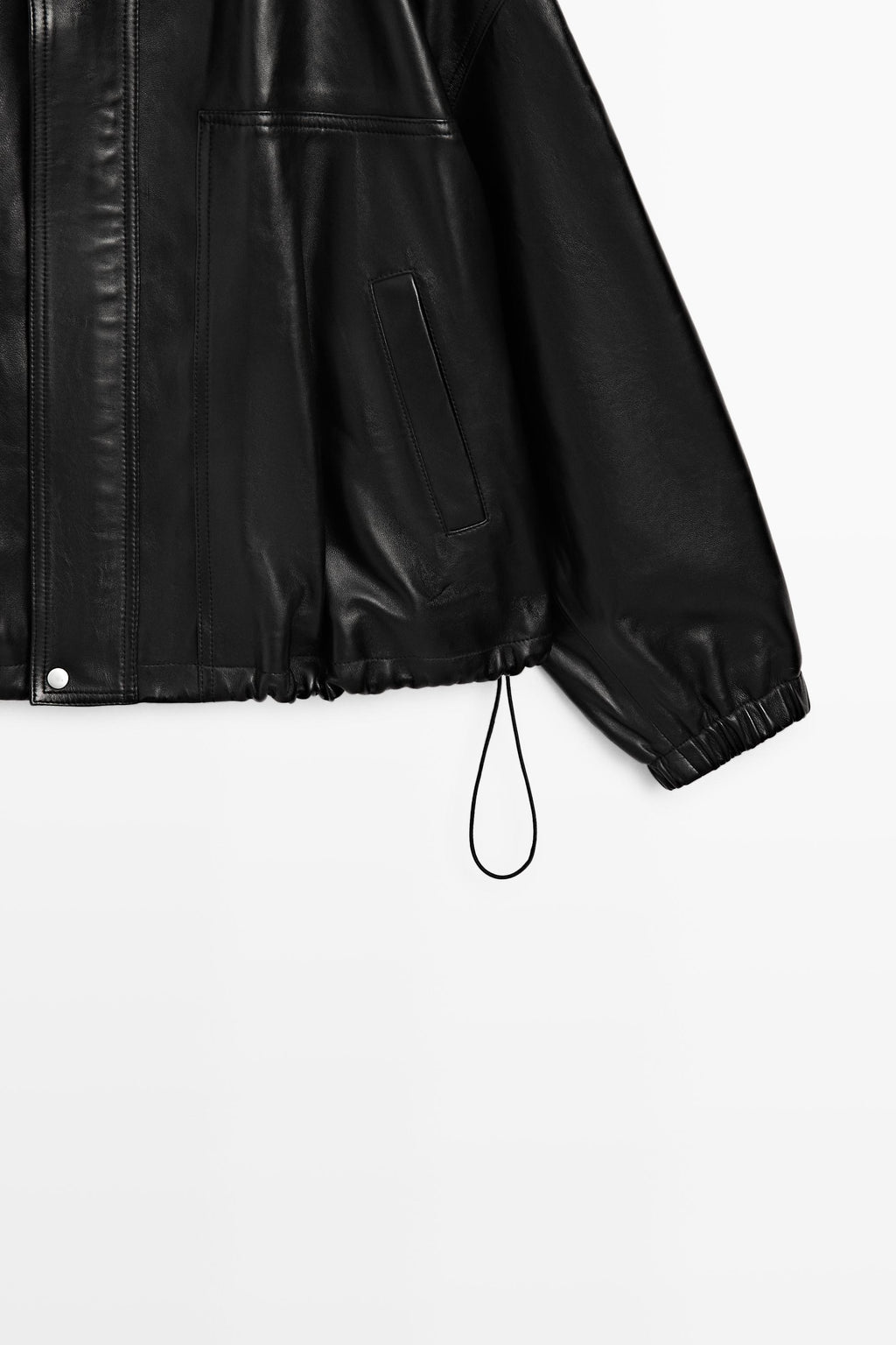Close-up of a black leather jacket sleeve and side panel with a drawstring hem, shown on a plain light background.