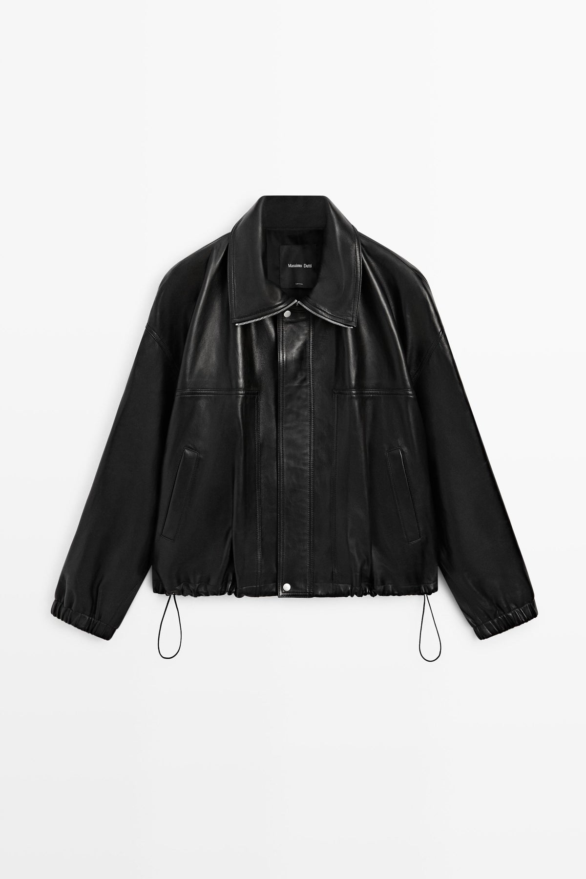 A black leather jacket with a pointed collar, asymmetrical front zipper, and drawstring hem, shown flat against a light gray background.