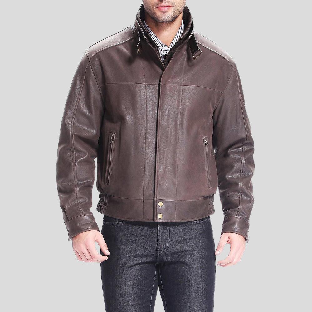 Brown leather jacket worn by a person on a gray background