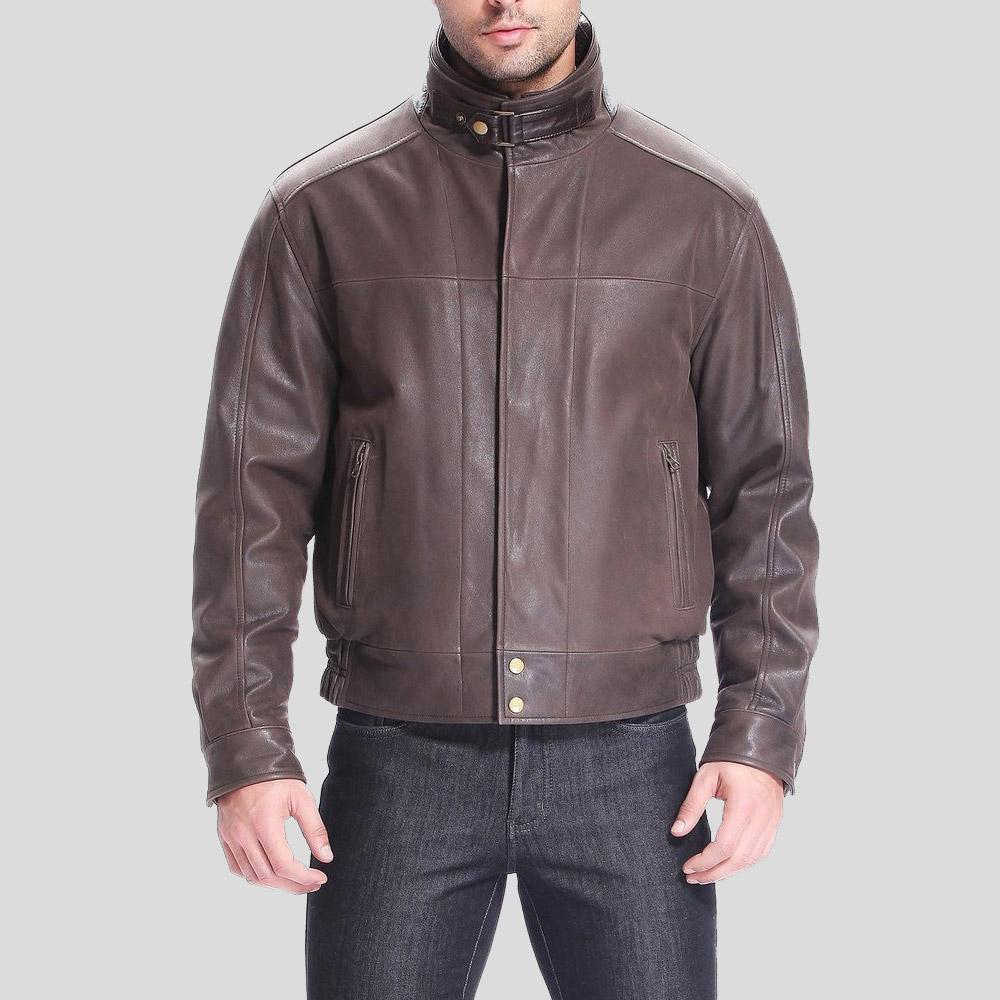 Brown leather jacket worn by a person on a light gray background