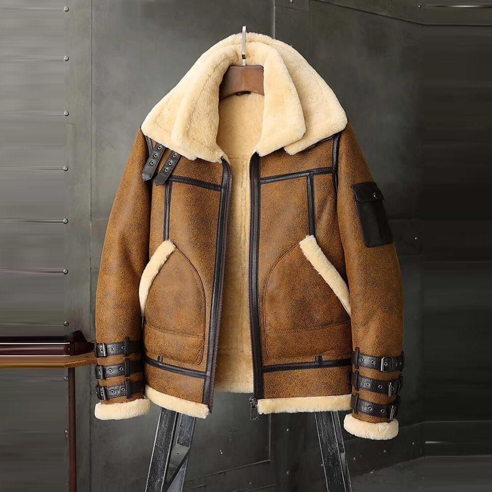 Brown shearling jacket with beige interior on a hanger against a dark background