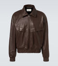 Brown leather jacket on a light gray background