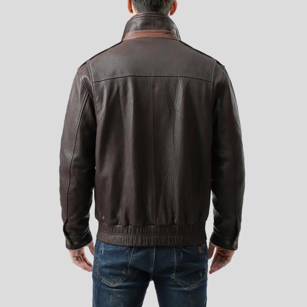 Brown leather jacket worn by a person on a light gray background