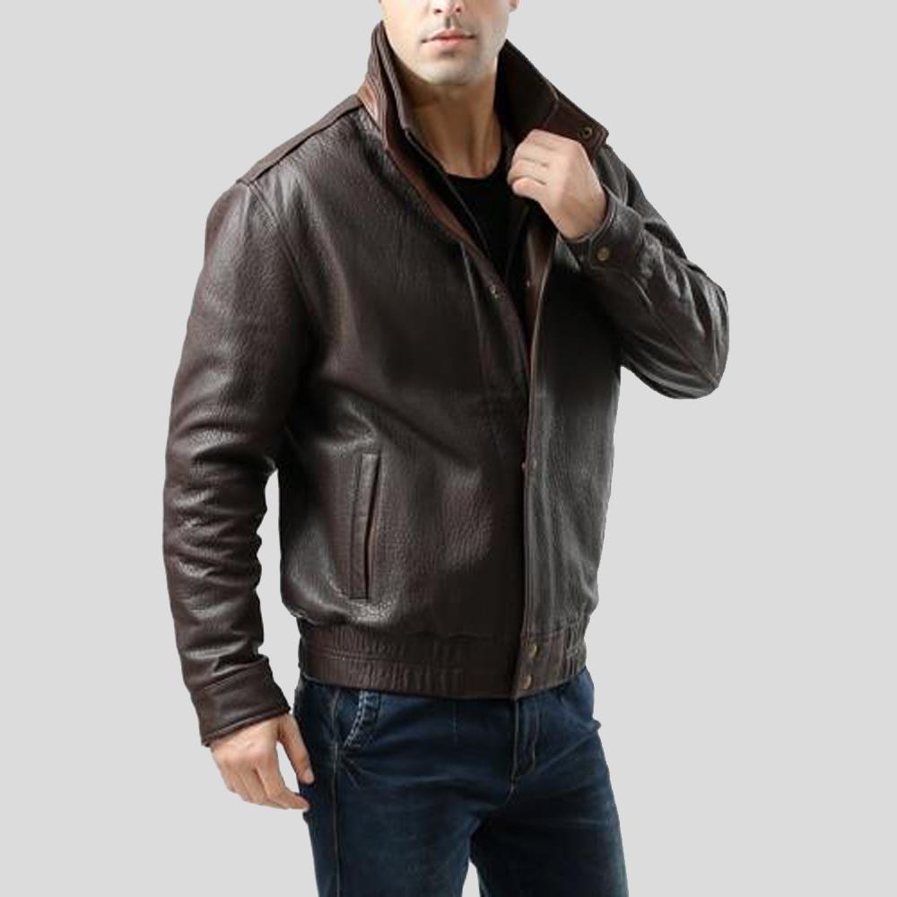 Man wearing a brown leather jacket on a light gray background