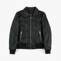 A black leather jacket with silver zippers and ribbed black cuffs and hem, displayed flat against a light gray background.