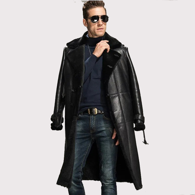 Man wearing a long black leather coat on a white background