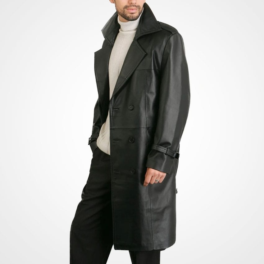 Man wearing a black leather trench coat on a white background