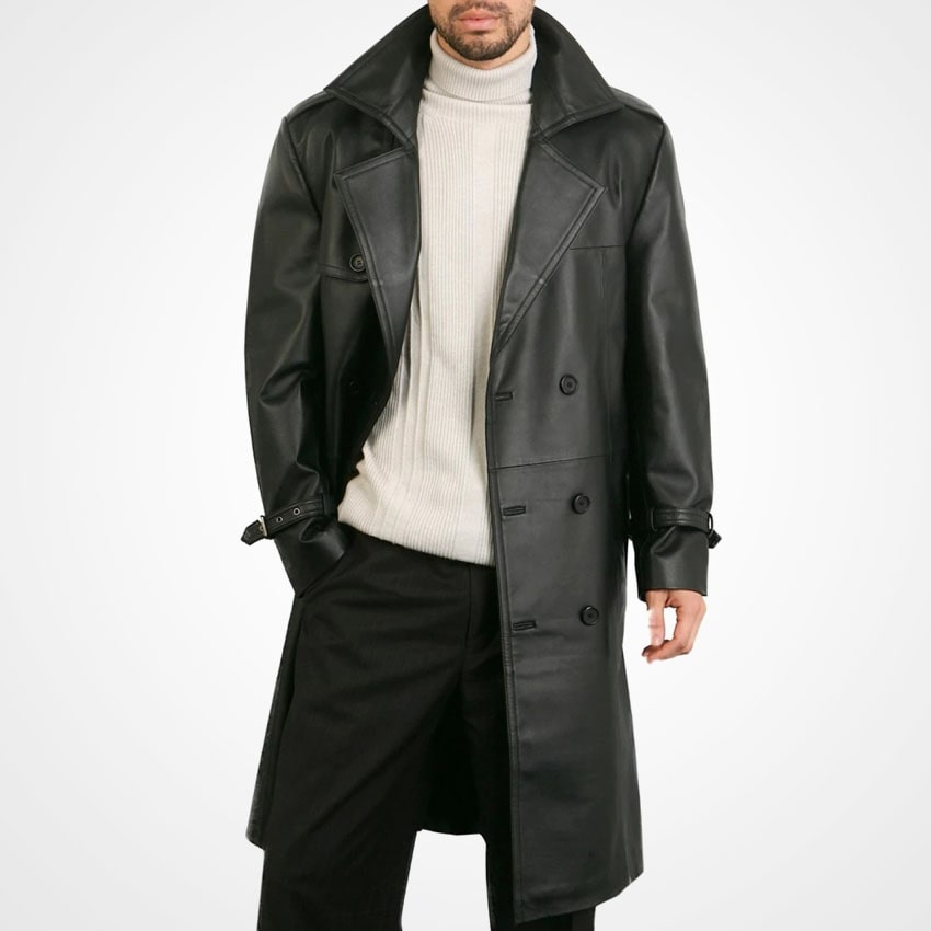 Man wearing a black leather coat over a white sweater on a white background