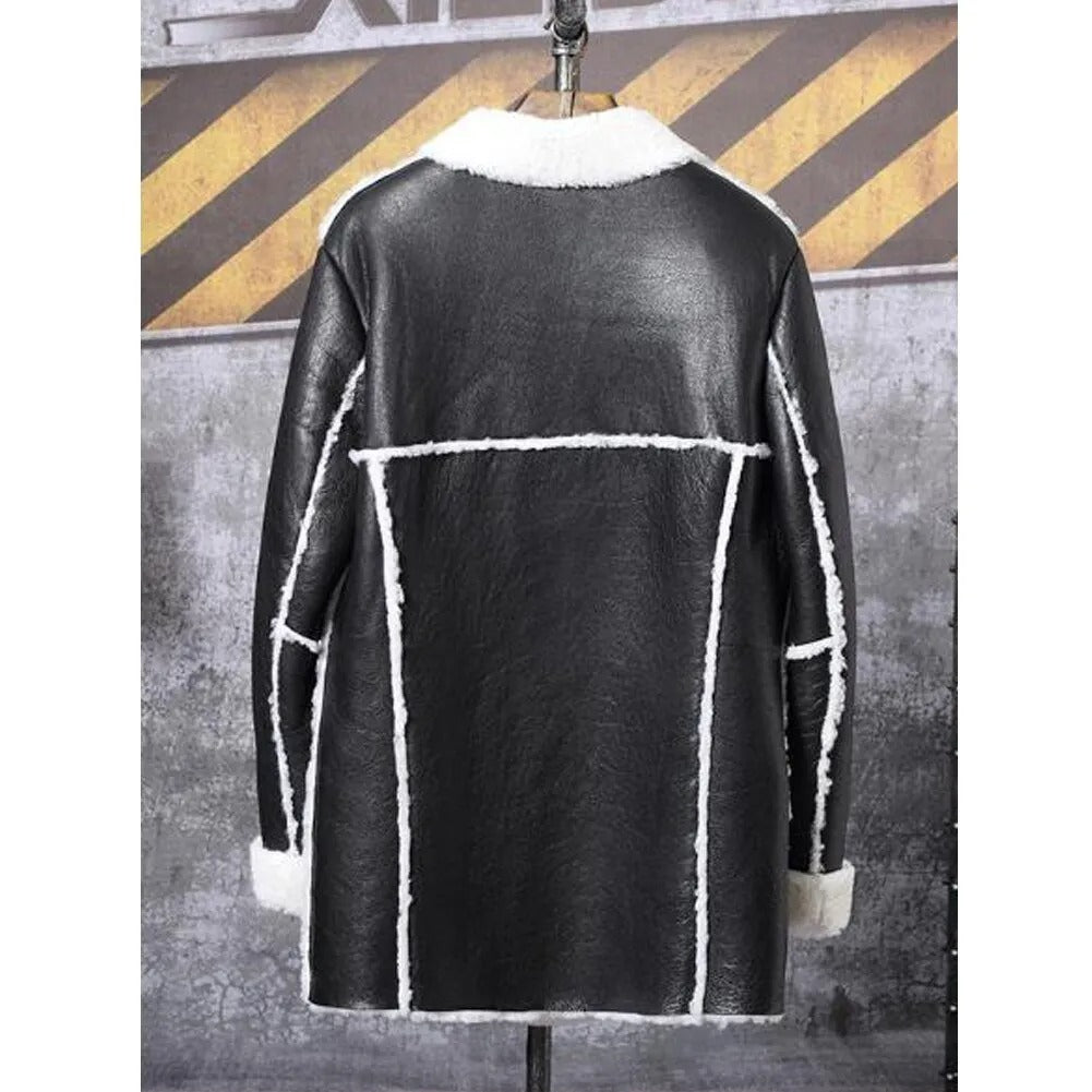 Black leather jacket with white fur trim on a mannequin against a textured wall background