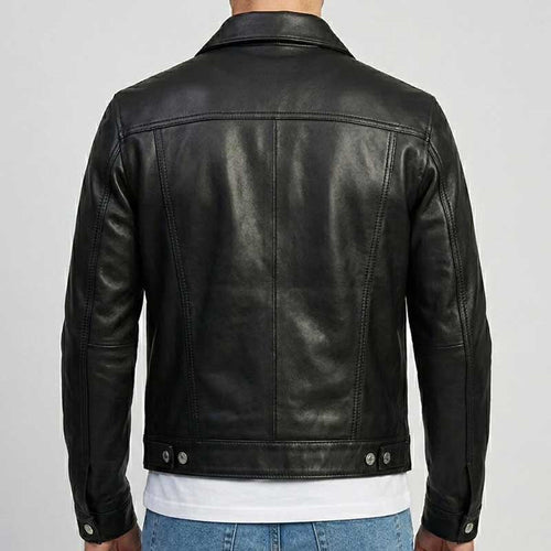 A man wearing a black leather jacket, shown from the back. The jacket has a classic collar, long sleeves, and silver snap buttons at the hem and cuffs.