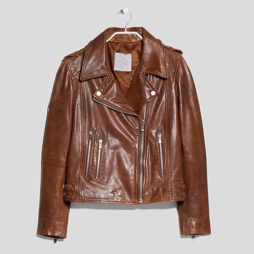 rich brown biker jacket hanging on white wall
