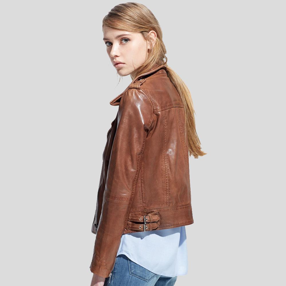 Woman wearing a brown leather jacket on a plain background