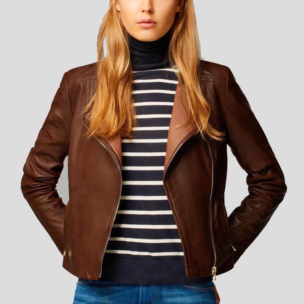 Person wearing a brown leather jacket over a striped shirt on a plain background