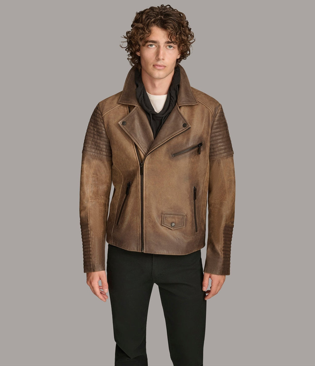 Man wearing a brown leather jacket on a gray background