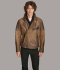 Man wearing a brown leather jacket on a gray background