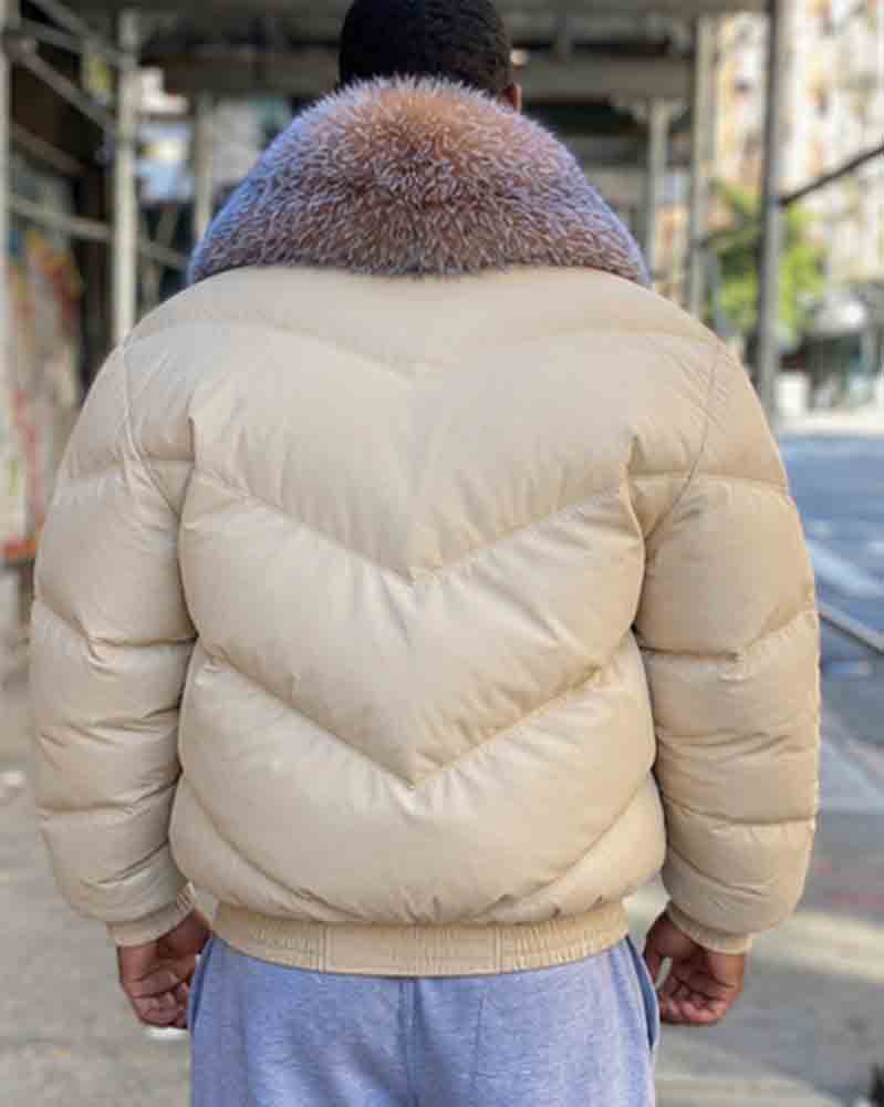 A man viewed from behind wearing an off-white Goose Country jacket
