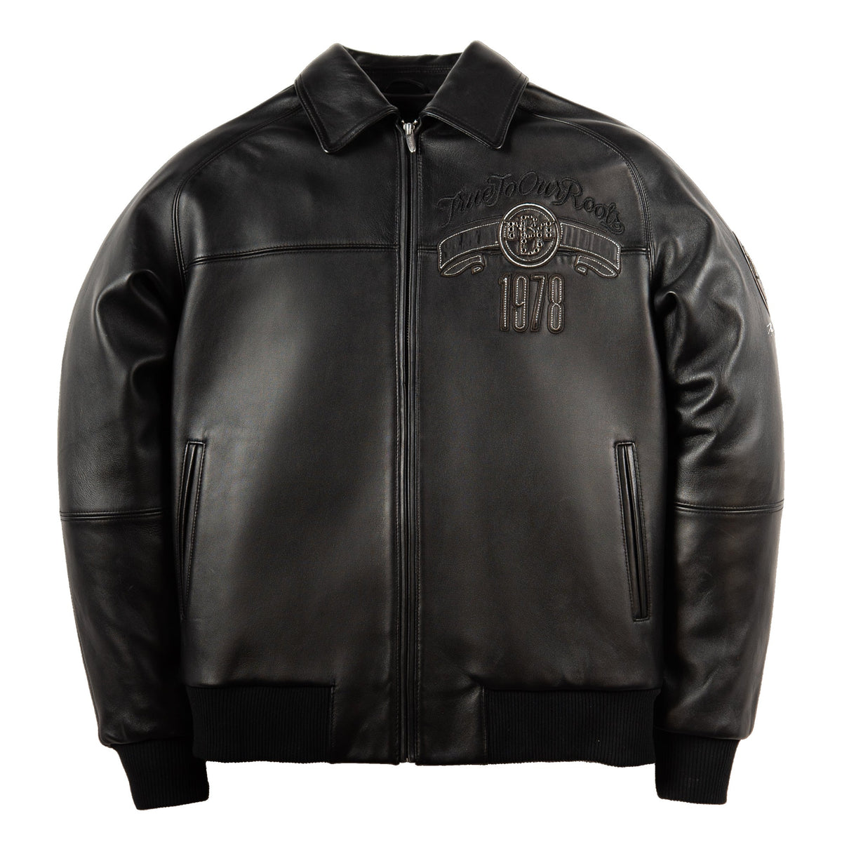 A black leather jacket with a front zipper, ribbed knit collar, cuffs, and hem. The left chest features a debossed graphic with the text 'Hard To Find Rock' and '1978'.