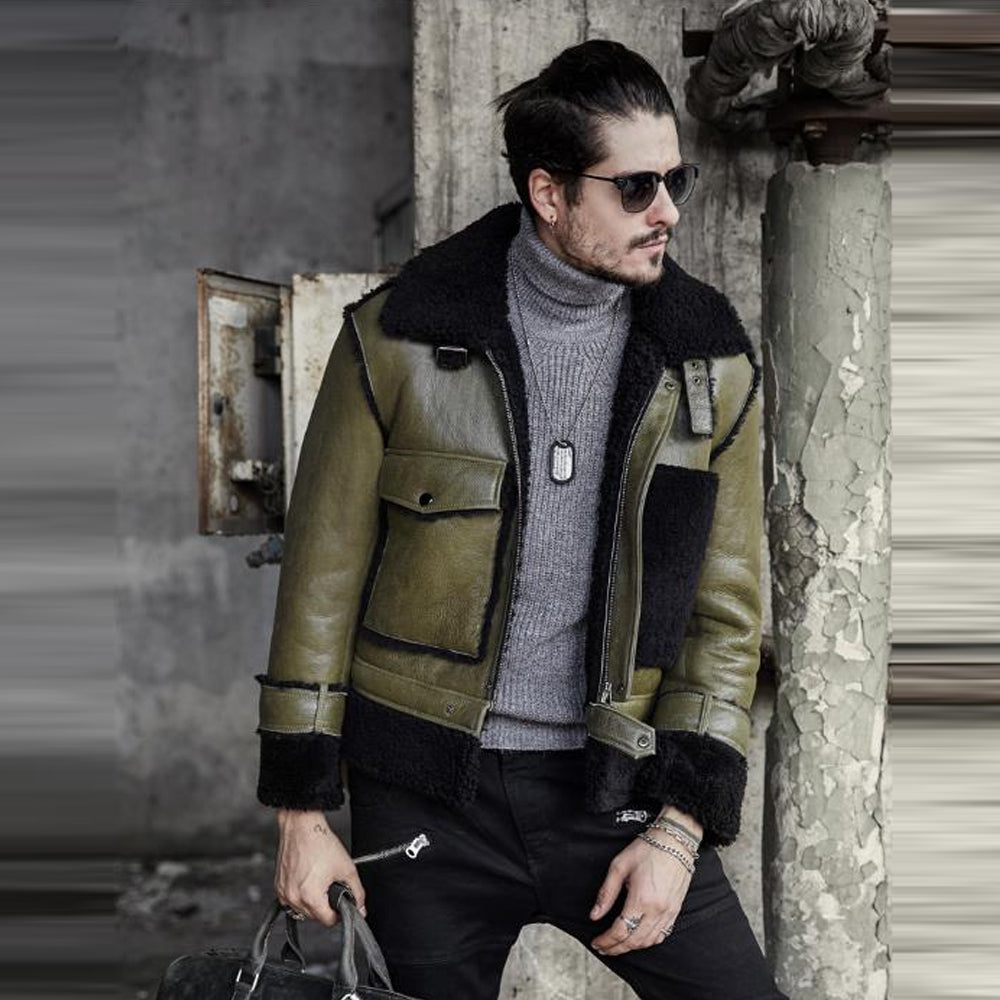 Man wearing a green leather jacket with black fur trim in an urban setting.
