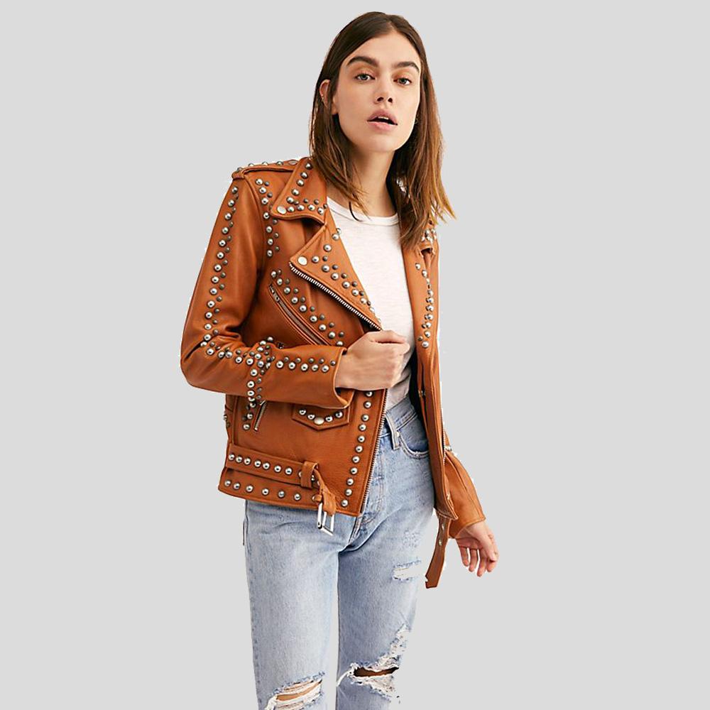 Woman wearing a brown leather jacket with studs on a light gray background