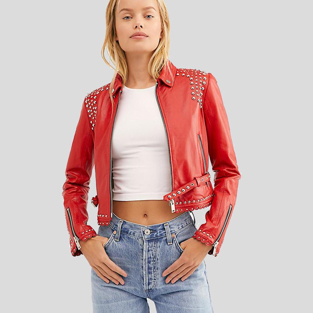 Person wearing a red studded leather jacket on a light gray background