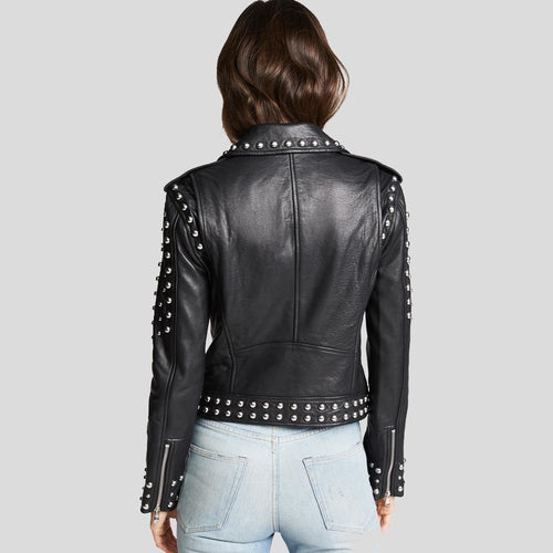 Black leather jacket with studded details on a gray background
