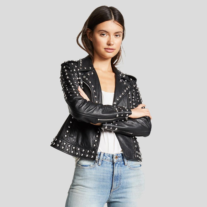 women wearing black leather jacket on grey background