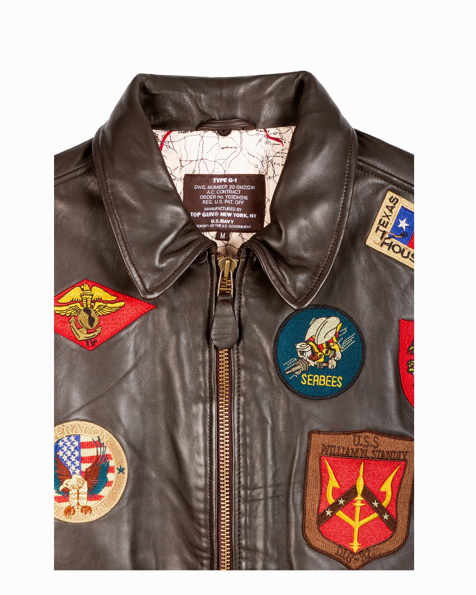 Brown leather jacket with various patches on a white background