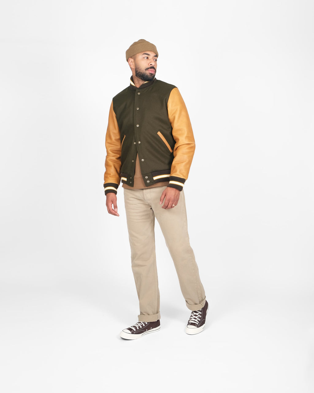 mdel posing wearing varsity jacket